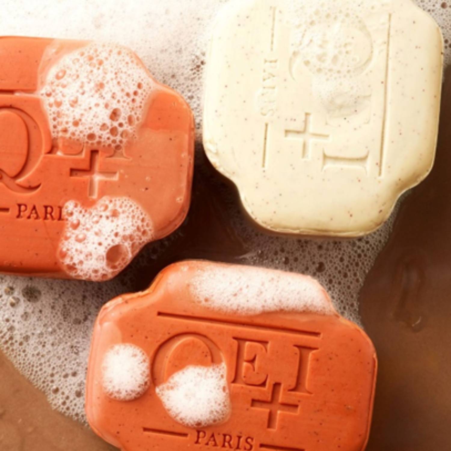 QEI+ Paris exfoliating soaps with apricot kernel beads in foam